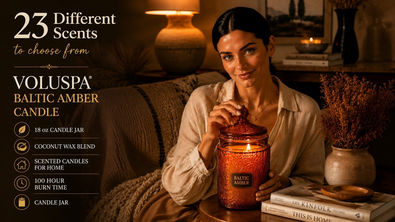 The Voluspa Baltic Amber: The Last Accessory Your Room Is Missing Lit Voluspa Baltic Amber candle in an embossed amber glass jar beside stacked coffee-table books