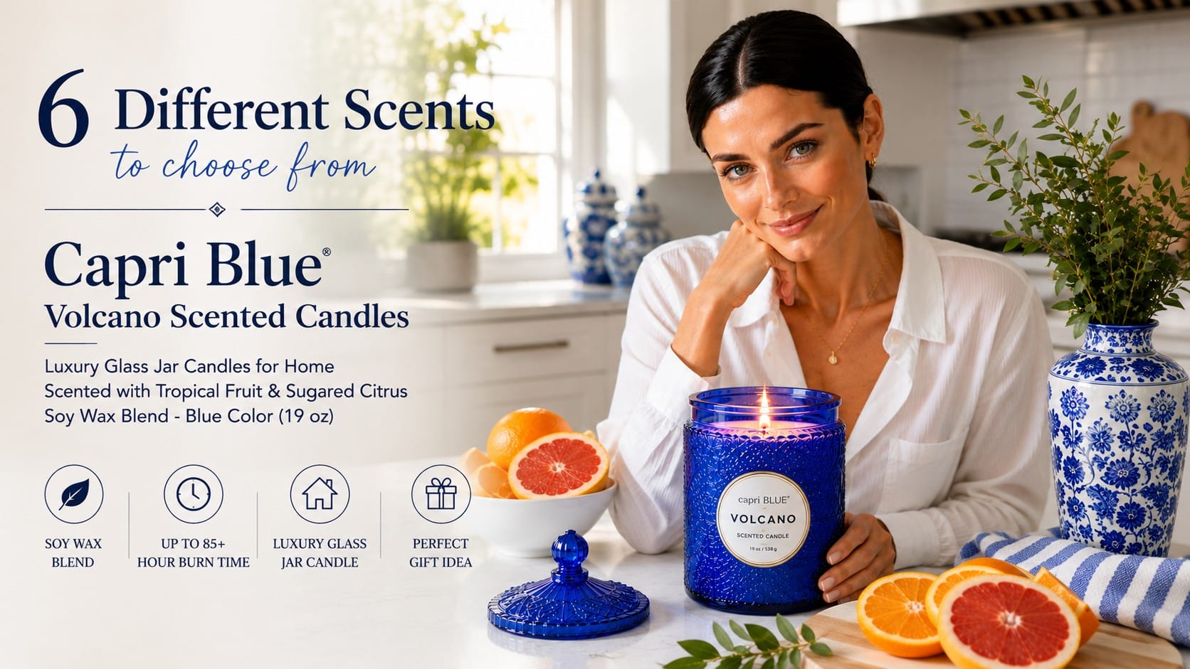 The Capri Blue Volcano: The Candle You've Already Smelled a Hundred Times Lit Capri Blue Volcano candle in a pressed cobalt-blue glass jar on a white kitchen counter with citrus