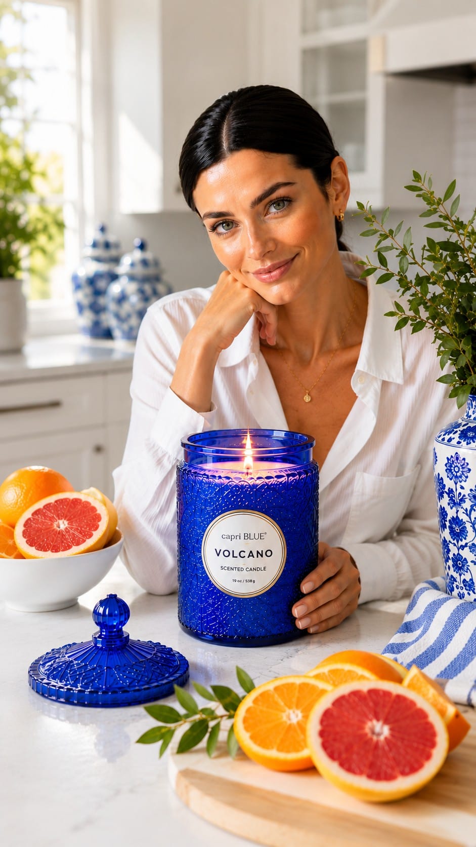 Capri Blue Volcano Scented Candle, 19 oz Blue Signature Jar Capri Blue Volcano 19 oz candle in the signature cobalt blue embossed glass jar, lit on a side table