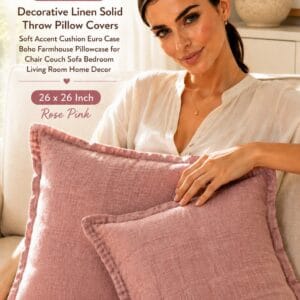 Foindtower set of 2 solid linen euro pillow covers with flange edges layered on a bed