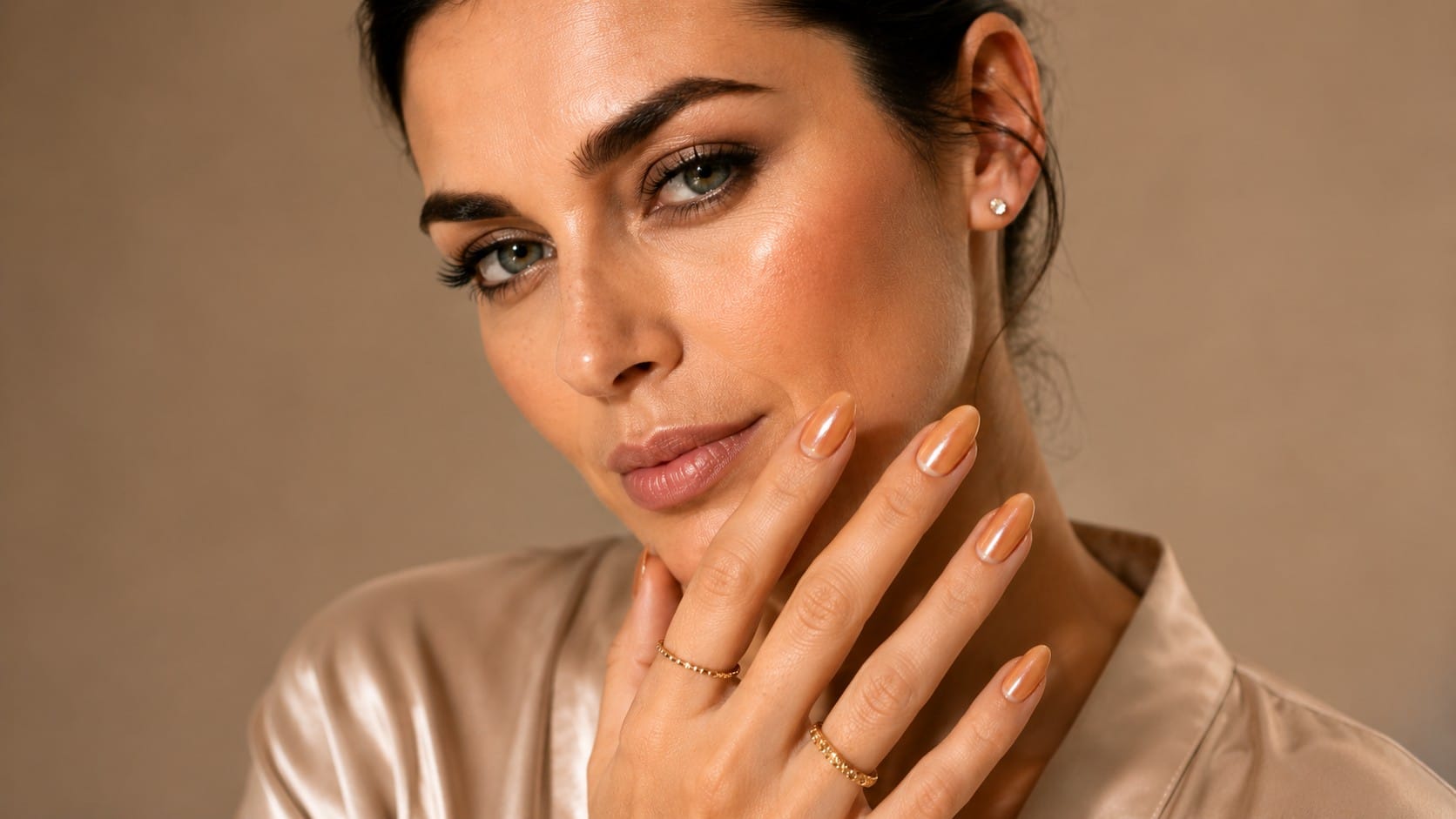 Glamnetic Maple Glaze Review: The Quiet-Luxury Manicure You Can Do at Your Kitchen Table Glamnetic Maple Glaze short almond press-on nails in a glazed nude-taupe finish worn on a hand