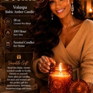 Voluspa Baltic Amber 18 oz candle in an embossed glass jar with a metal lid, lit on a side table