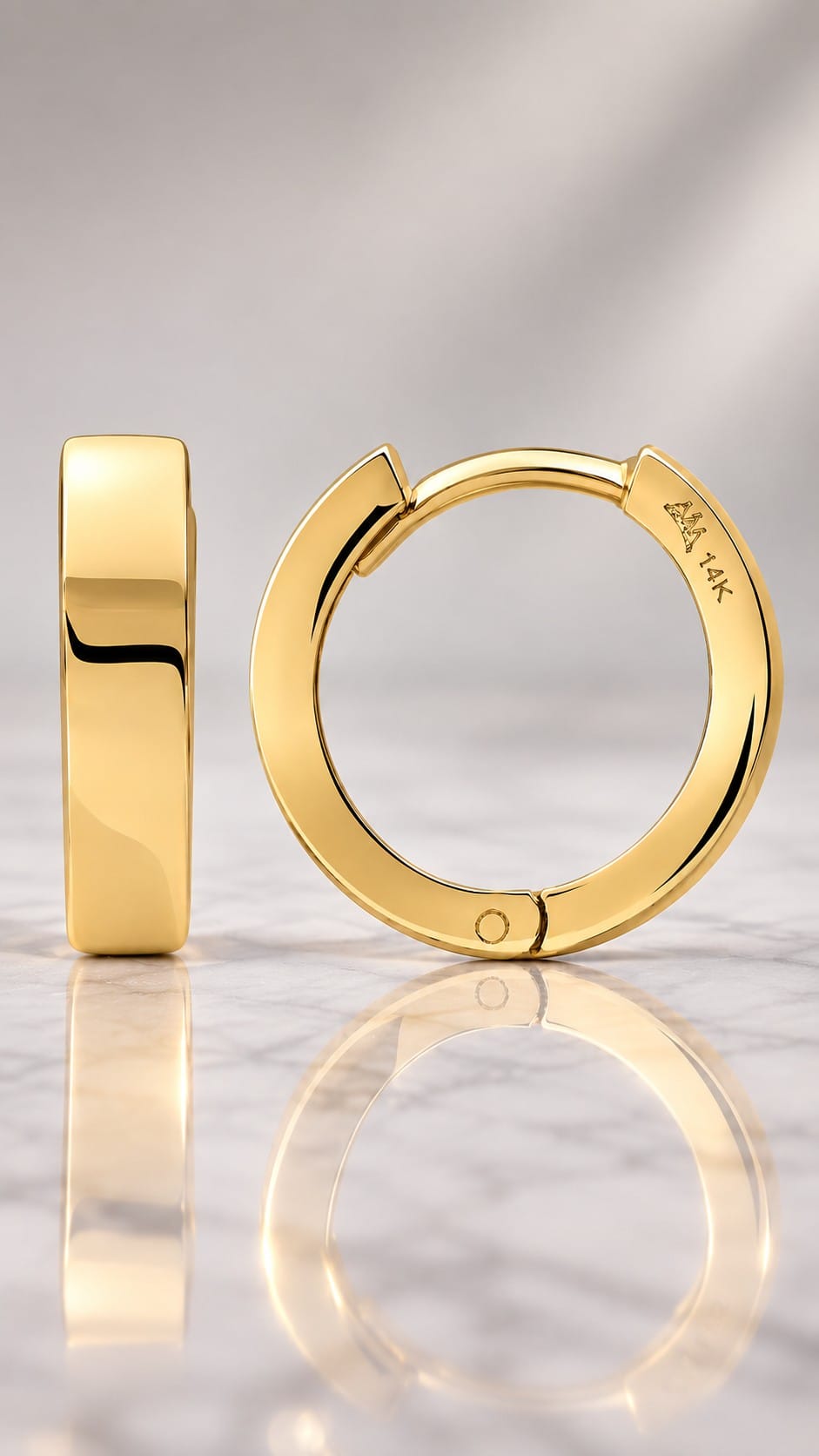 Solid 14K gold huggie hoop with hinged snap closure